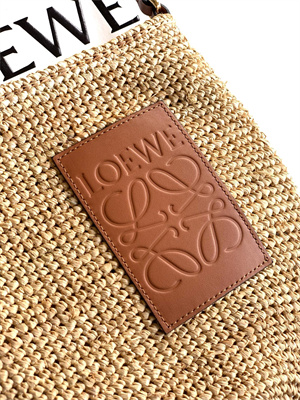 Loewe Slit pochette bag in raffia and calfskin Nature /Tan